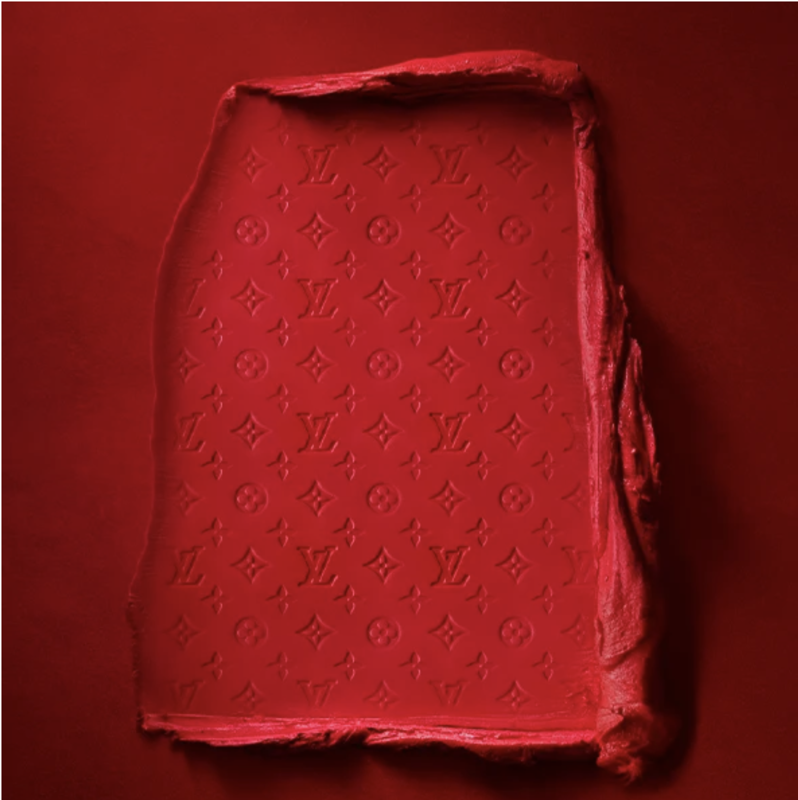 Red lipstick swatch embossed with the Louis Vuitton monogram